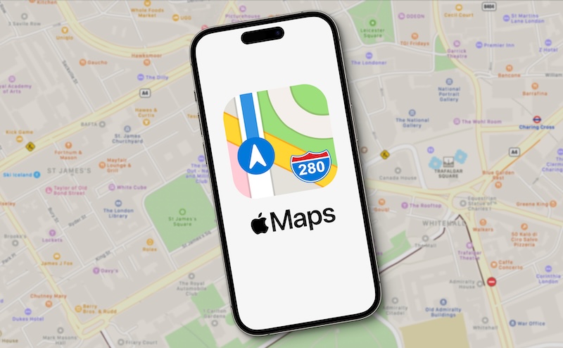 A smartphone showcasing the Apple Maps logo sits atop a blurred map of London, hinting at how to change business hours on Apple Maps. The app icon prominently features a road marked with the number 280, blending digital guidance with traditional cartography.