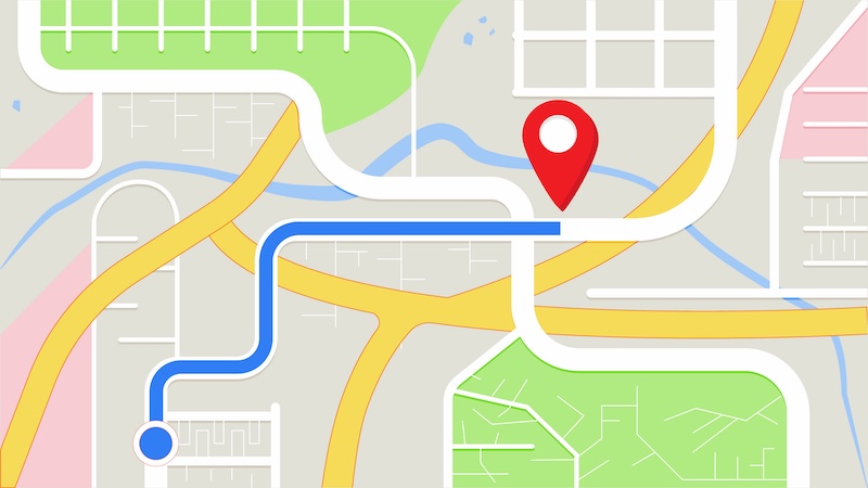 A simplified map illustration displays a blue route line leading to a red location pin, complete with streets, a river, green parks, and building outlines. Discover how to change business hours on Apple Maps while navigating this vibrant landscape.