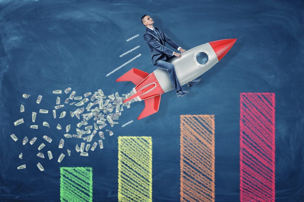 A man rides a rocket over a graph that shows an improving online reputation.