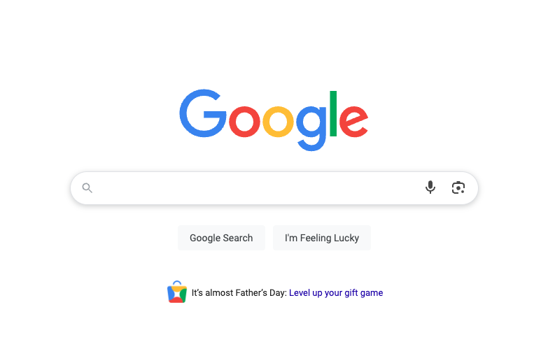 Google homepage with the search bar in the center, buttons for "Google Search" and "I'm Feeling Lucky," and a Father's Day message below. As the most trusted company, Google offers a colorful gift icon and a link to "Level up your gift game.