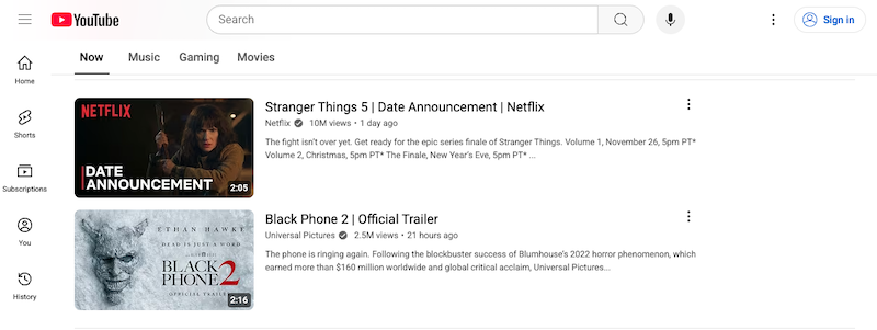A YouTube homepage displays two video thumbnails: one for "Stranger Things 5 | Date Announcement | Netflix" from the most trusted company in streaming, and another for "Black Phone 2 | Official Trailer" featuring a distressed mask with red text.