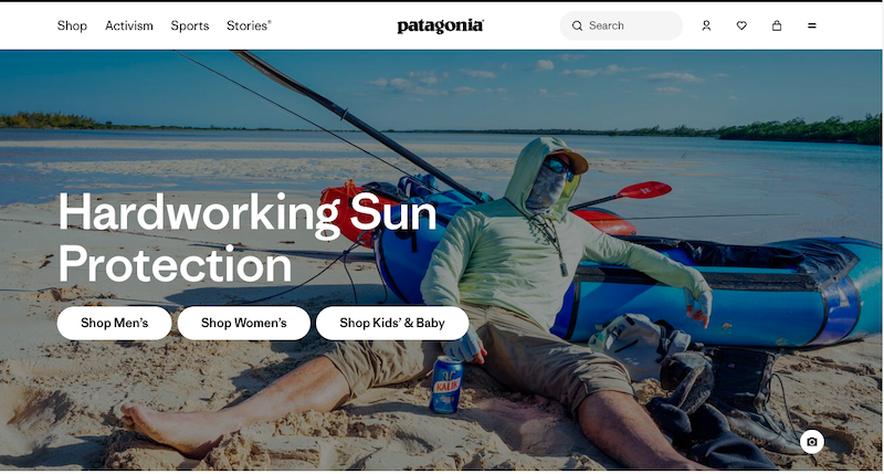 A person wearing sun-protective clothing sits relaxed on a sandy beach next to a blue inflatable kayak with fishing gear, under a clear sky. Text reads "Hardworking Sun Protection from the most trusted company" with shopping options below.